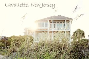 Lavallette, New Jersey in script in upper left corner above picture of beach home taken through beach grass.